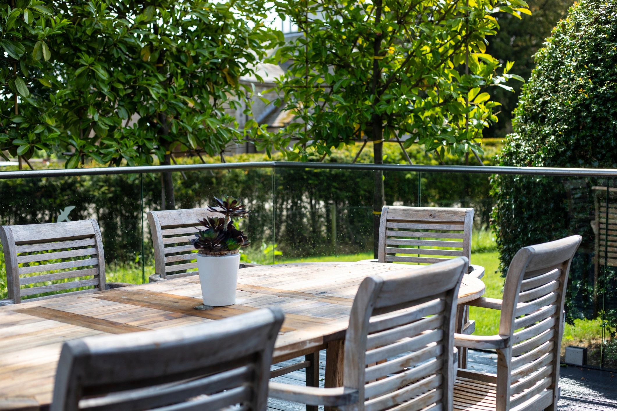 Backyard garden setting with fencing and outdoor living area